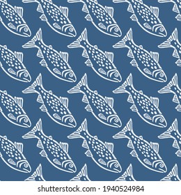 El bordado es un patrón sin fisuras con hermosos peces azules para la moda textil y de tela.