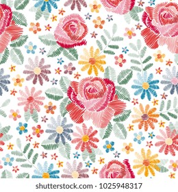 Embroidery seamless pattern with beautiful colorful flowers on white background. Fancywork in vintage style. Fashion design. Vector illustration.