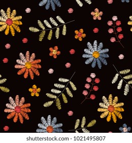 Embroidery seamless pattern with beautiful flowers. Summer print. Fashion design. Vector embroidered illustration.

