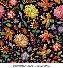Embroidery seamless pattern with beautiful flowers and leaves. Autumn print. Fashion design. Colorful embroidered illustration.