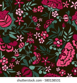 Embroidery seamless pattern with beautiful flowers. Vector floral ornament on black background. Embroidery for fashion textile and fabric.