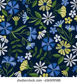 Embroidery seamless pattern with beautiful flowers. Vector floral ornament on dark blue background. Embroidery for fashion textile and fabric.