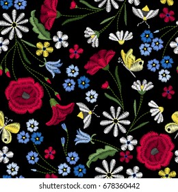 Embroidery seamless pattern with beautiful flowers. Vector floral ornament on black background. Embroidery for fashion textile and fabric.