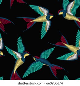 Embroidery seamless pattern with beautiful swallow birds. Vector embroidery for fashion textile and fabric.