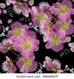 Embroidery seamless pattern with big dog roses and forget me not flowers. Vector traditional folk fashion floral ornament on black background for design.