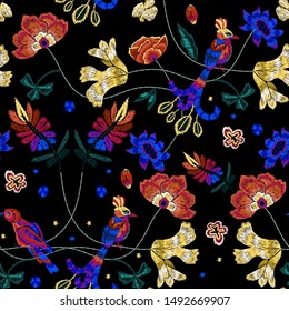Embroidery seamless pattern with birds and flowers. Vector embroidered floral patch.