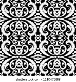 Embroidery seamless pattern. Black and white tapestry ornamental vector background. Ethnic grunge paisley flowers, shapes. Textured fabric pattern. Hand drawn patterned embroidered abstract ornaments.