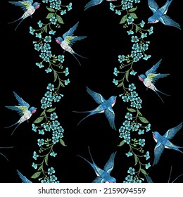 Embroidery seamless pattern with blue forget-me-not flowers and  swallows  on a black background.
Vector seamless embroidered template with flowers and birds for fashion design.