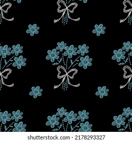 El bordado es un patrón sin fisuras con ramo de flores azules sobre fondo negro para tela ,textil.