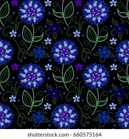 Embroidery seamless pattern with cornflowers decorated with paillettes 
