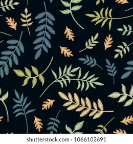 Embroidery seamless pattern with different leaves on black background. Vector illustration.