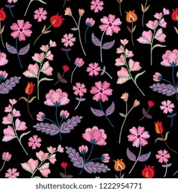 Embroidery seamless pattern with different wild flowers. Vector floral ornament on black background. Satin stitch.