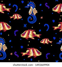 Embroidery seamless pattern with fishes and seahorse. Vector embroidered marine patch.