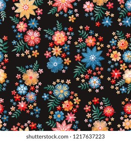 Embroidery seamless pattern with groups of beautiful flowers. Floral background in vintage style. Fancywork. Fashion design. Vector illustration.