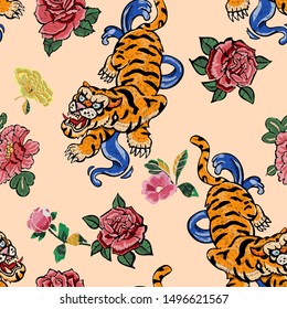 Embroidery seamless pattern with oriental tigers and roses. Vector embroidered floral patch.