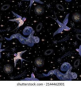 Embroidery seamless pattern with swallows and starry sky. Vector trend embroidered template with birds comets, galaxy and star on black background for fashion design