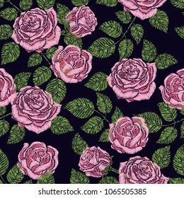 Embroidery seamless pattern texture, wallpaper, background with beautiful pink roses. Vector floral ornament on black background. Template for printing, textiles, design
