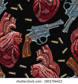 Embroidery seamless pattern. Wild West gangster background, vintage revolvers and red anatomical hearts, template for clothes, textile t-shirt design