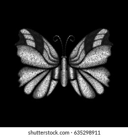 Embroidery silver colored butterfly design for clothing. Vector illustration satin stitch texture isolated on black background.