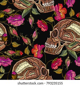 Embroidery skull and flowers seamless pattern. Fashion template for clothes, textiles, t-shirt design. Gothic romantic embroidery human skulls red roses and peonies pattern