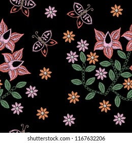 Embroidery stitches imitation seamless pattern with folk flower and butterfly. Fashion embroidery flower on black background. Embroidery flower vector.