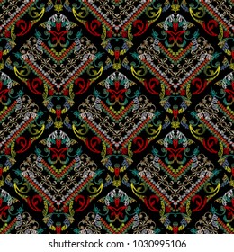 	
Embroidery striped baroque vector seamless pattern. Colorful floral grunge background. Tapestry wallpaper.  Damask flowers, scroll, leaves, stripes, old baroque ornaments. Embroidered fabric texture