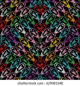 Embroidery style colorful seamless pattern. Black vector  background with grunge tapestry colored geometric shapes, figures, rhombus, triangles, love hearts and abstract ornaments.