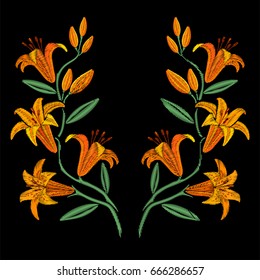 Embroidery symmetrical yellow lily flowers.