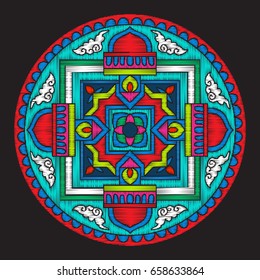 Embroidery with tibet mandala on black background. 
