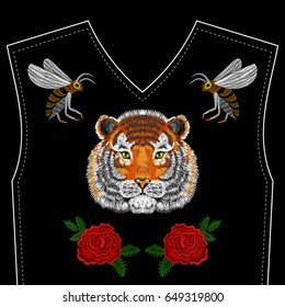 Embroidery Tiger face, bee, roses for neckline. Vector fashion embroidered ornament on black background for fabric traditional folk floral decoration.