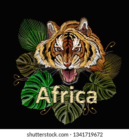 Embroidery tiger and palm leaves. Africa slogan. Fashionable template for clothes, t-shirt design 