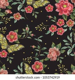 Embroidery trend floral seamless pattern with roses and exotic butterflies. Vector traditional folk flowers decor on black background for clothing design.