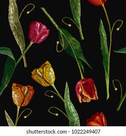 Embroidery tulips seamless pattern. Fashionable template for design of clothes, t-shirt design, tapestry. Classical embroidery red and yellow tulips 