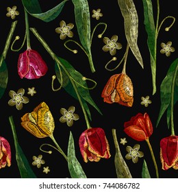 Embroidery tulips and summer flowers seamless pattern. Classical embroidery red and yellow tulips. Fashionable template for design of clothes, t-shirt design, tapestry 