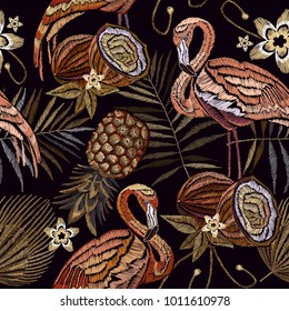 Embroidery vintage flamingo , palm tree leaves, pineapple, coconut tropical seamless pattern. Fashionable embroidery pink flamingos, tropical summer background. Template for design of clothes 