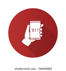 Emergency calling flat design long shadow glyph icon. Hand holding smartphone with 911 number. Vector silhouette illustration