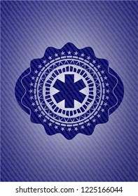 emergency cross icon with denim texture
