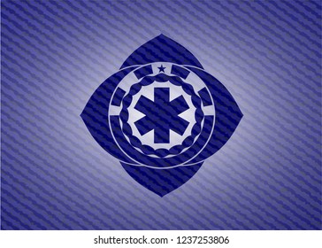 emergency cross icon with denim texture