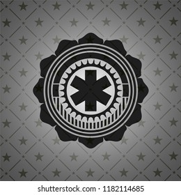 emergency cross icon inside black emblem