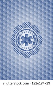 emergency cross icon inside blue hexagon badge.
