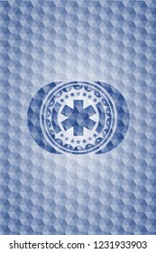 emergency cross icon inside blue polygonal badge.