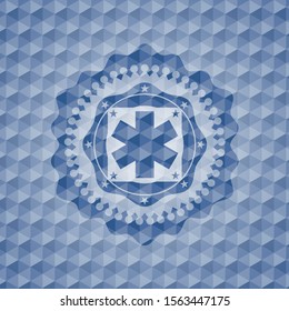 emergency cross icon inside blue emblem with geometric pattern background.
