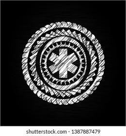 emergency cross icon inside chalk emblem