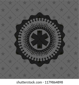 emergency cross icon inside dark badge or emblem