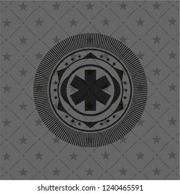 emergency cross icon inside dark badge or emblem