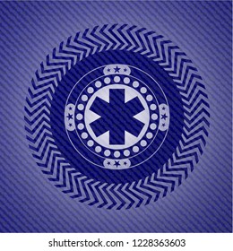 emergency cross icon inside denim background