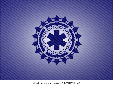 emergency cross icon inside emblem with jean texture