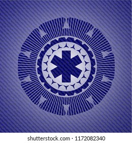 emergency cross icon inside emblem with jean background
