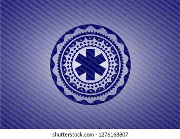 emergency cross icon inside emblem with jean high quality background