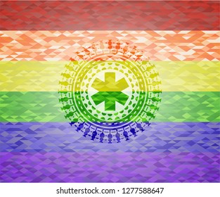 emergency cross icon inside emblem on mosaic background with the colors of the LGBT flag